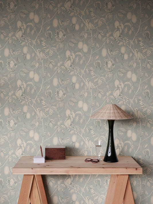  Lemurs peek playfully through the foliage in our Elliot wallpaper, bringing a soft exotic vibe to any room. 