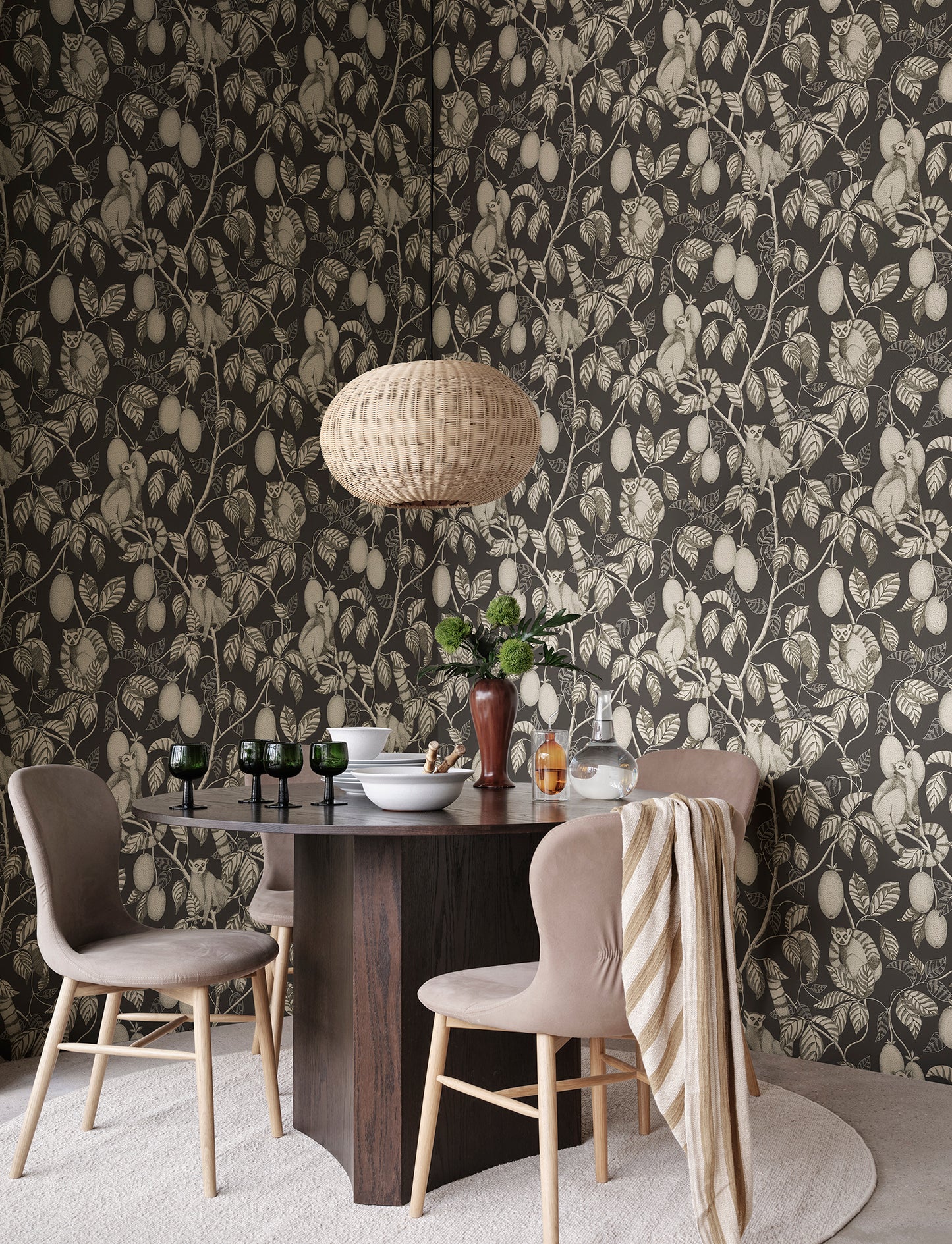 Elliot wallpaper captivates with curious lemurs cleverly camouflaged in lush foliage.