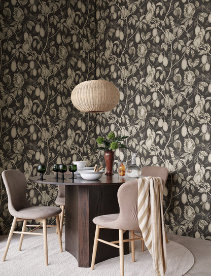 Elliot wallpaper captivates with curious lemurs cleverly camouflaged in lush foliage.