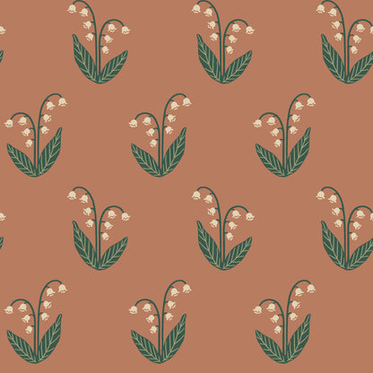  The Lilly wallpaper in terracotta features the beloved lily of the valley with its graceful graphic simplicity. 