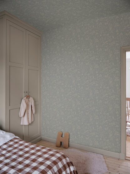 Discover the Hollie wallpaper, where a misty blue backdrop unfolds a fantasy forest teeming with whimsical animals and delicate botanical details.