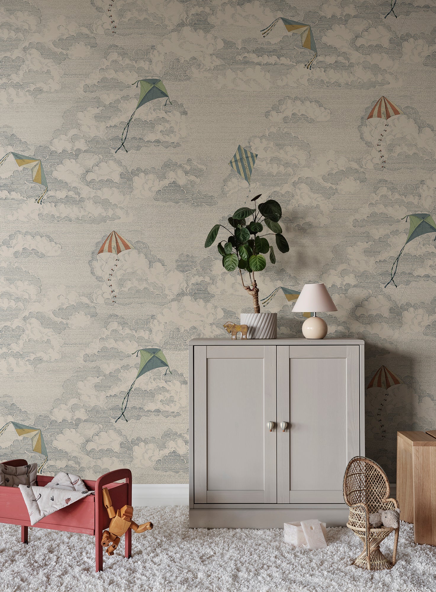 This whimsical wallpaper captures the nostalgia of flying kites against a dreamy sky filled with fluffy clouds.