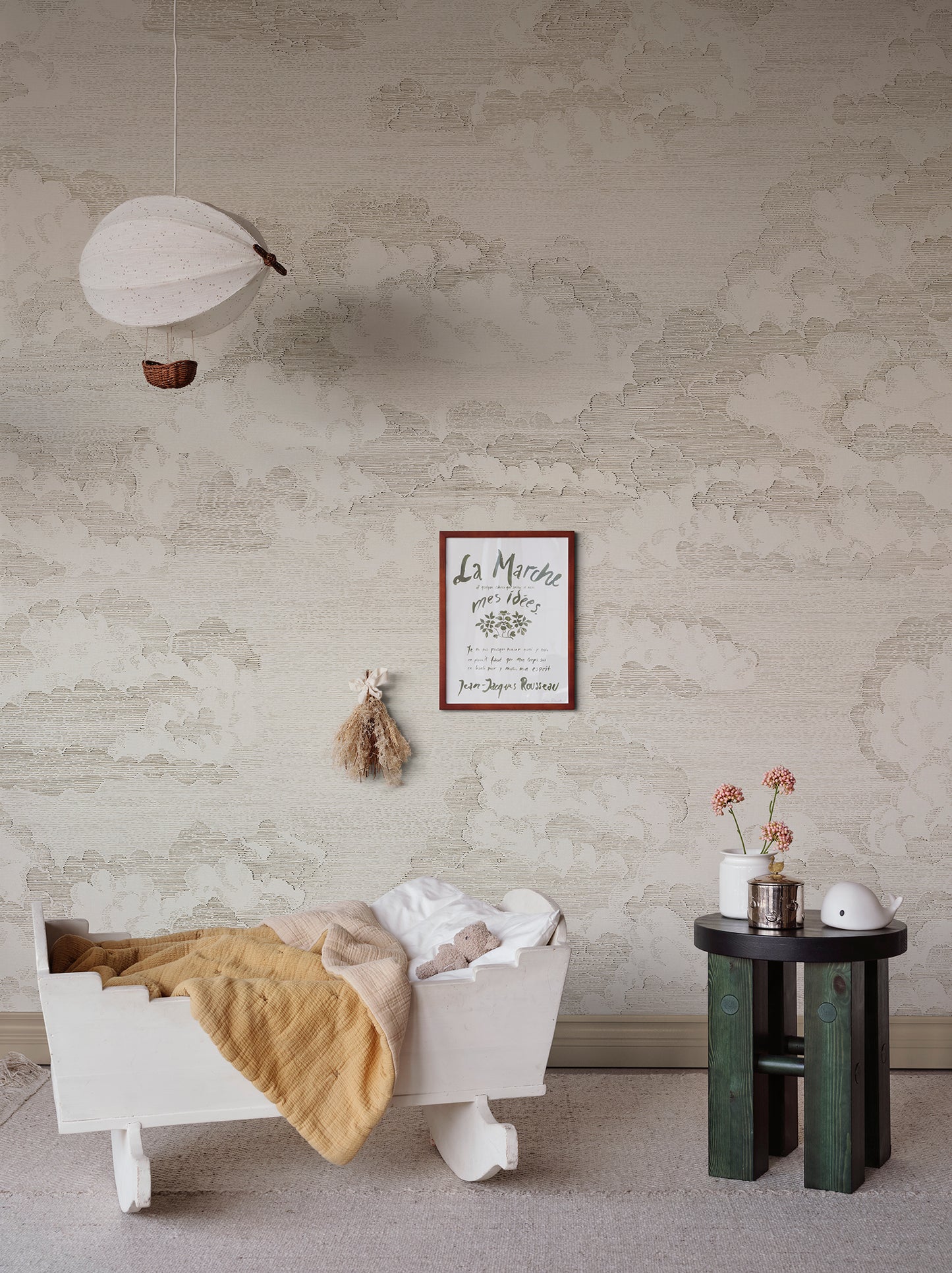 Bonnie invites tranquility with its hand-drawn clouds on wallpaper, evoking a dreamy atmosphere reminiscent of old etchings.