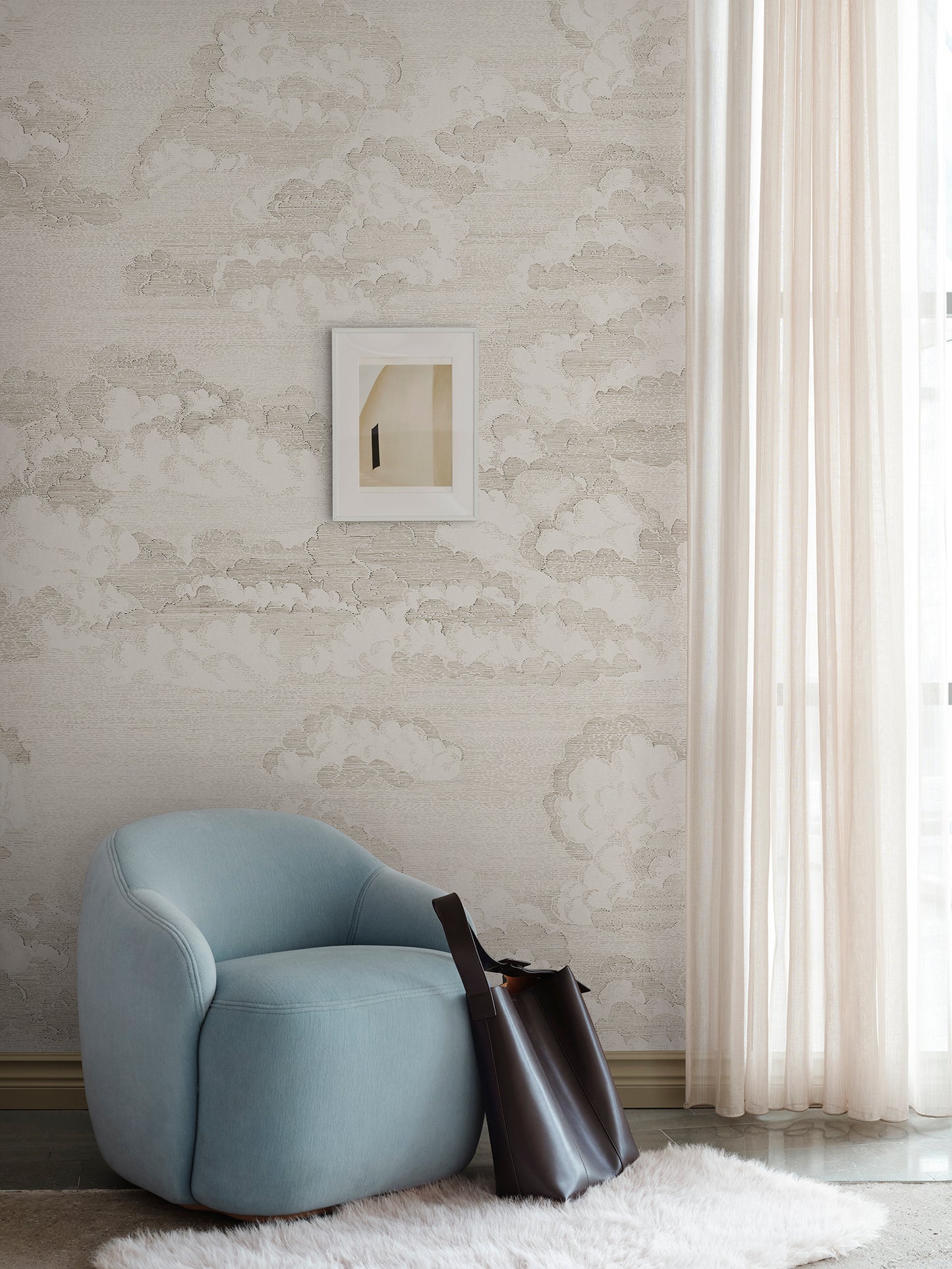 Bonnie invites tranquility with its hand-drawn clouds on wallpaper, evoking a dreamy atmosphere reminiscent of old etchings.