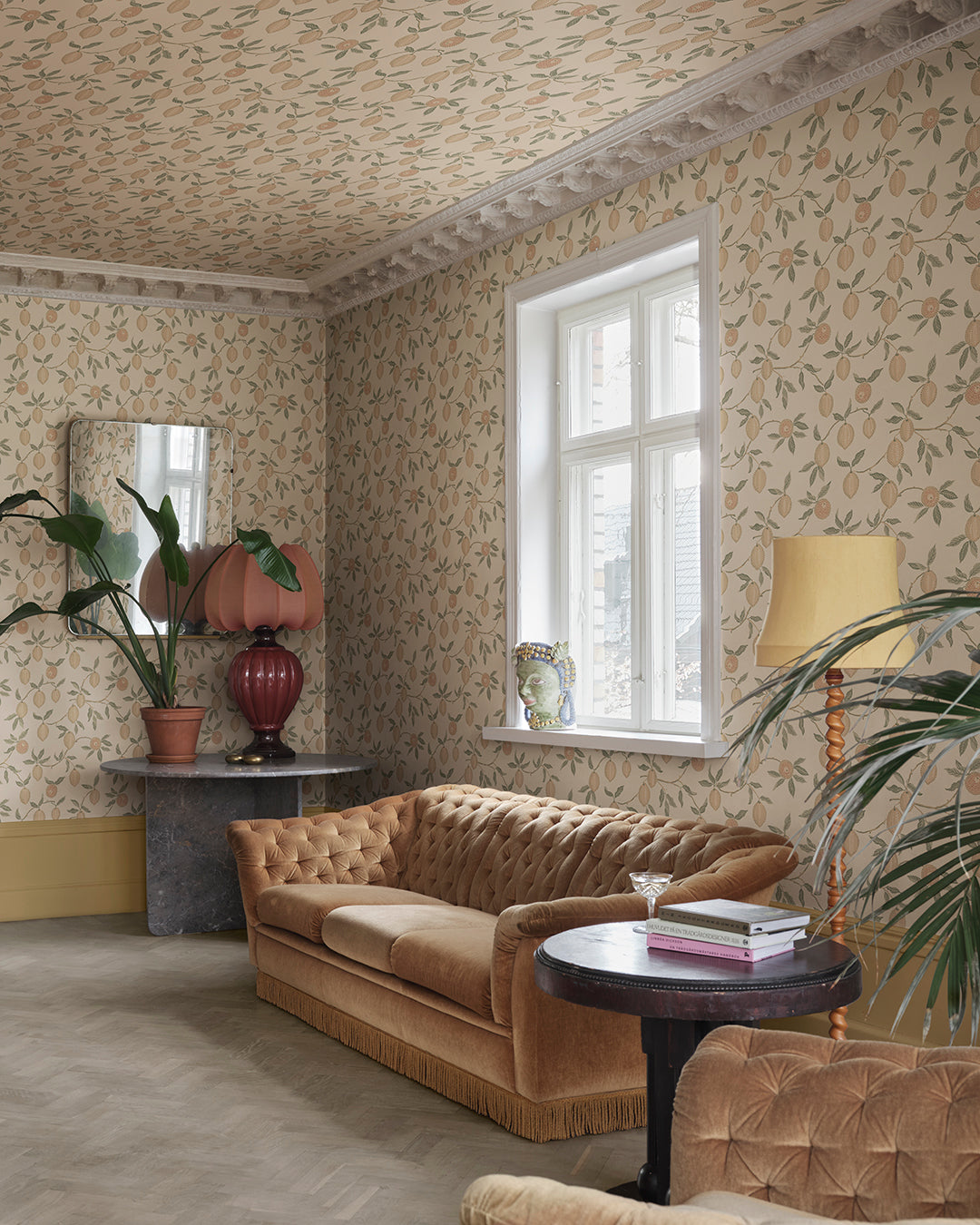 Infuse your space with the delightful essence of Italian lemon groves with our Limone Blush wallpaper. Elegant blush lemons and soft green leaves meander gracefully on a warm backdrop, evoking the sunny vibrance of a Mediterranean escape. Perfect for adding a splash of nature's freshness and charm to any room.
