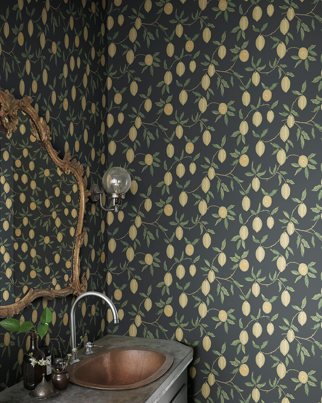 Embrace the essence of Mediterranean lemon groves with Limone in Charcoal. The vibrant lemon branches against a deep charcoal backdrop bring a fresh yet sophisticated touch to any space. This pattern is perfect for adding a slice of sunshine and a pop of color to your interiors.