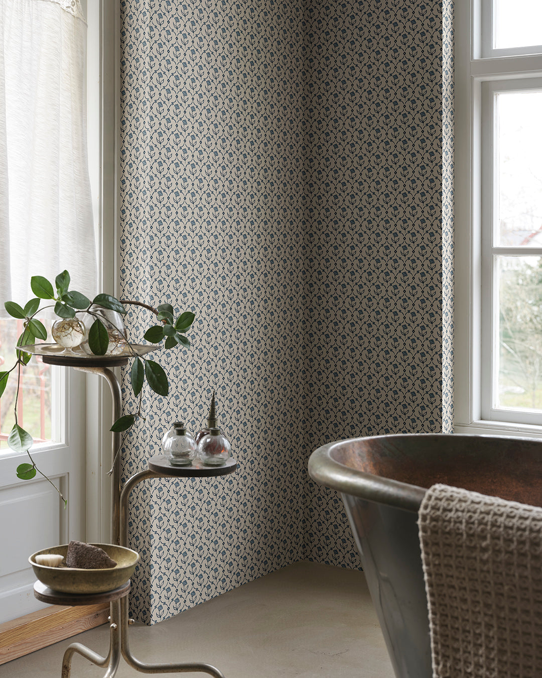 Elena Blue: A Timeless Floral Embrace
Elena in Blue offers a classic floral medallion design with echoes of domino paper and folk trellis patterns. This delicate print brings a touch of history, elegance, and charm to any room.