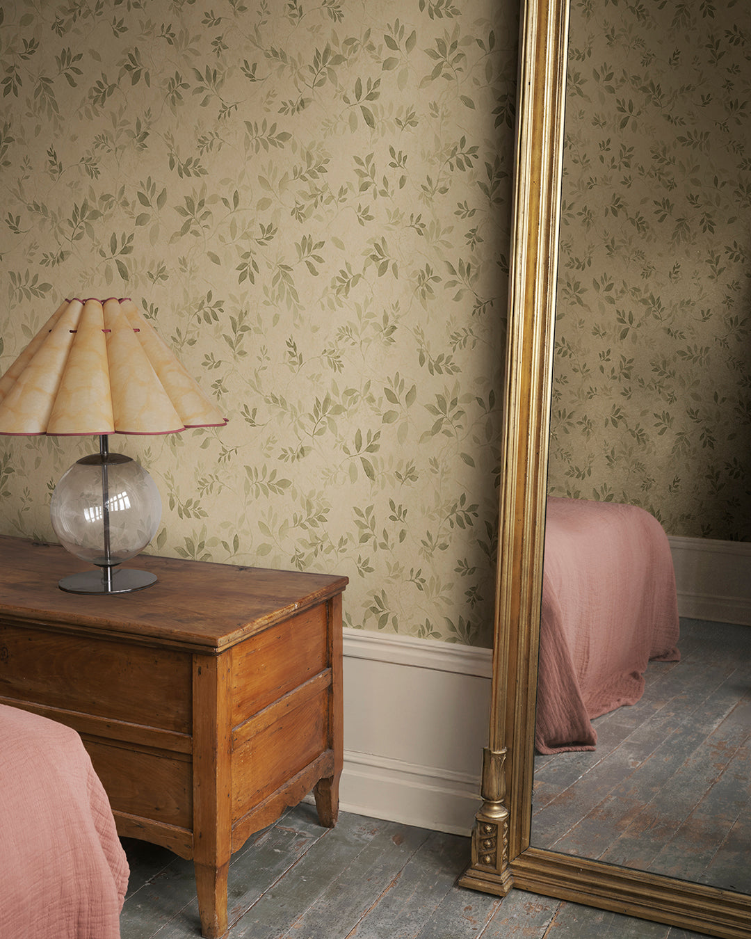 Invoke a romantic aura with the Mila wallpaper. Inspired by antique frescoes, its olive green leafy vines exude depth and patina, creating a timeless elegance in any space. The pattern’s charm lies in its ability to bring walls to life, embodying a beautifully aged look that melds seamlessly with your decor.