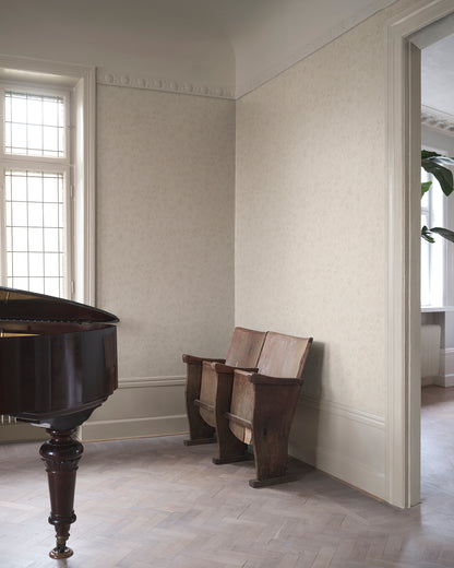 Infuse your space with the elegance of the Mila Beige wallpaper. This pattern, inspired by antique al fresco paintings, features romantic leafy vines with a warm patina. The subtle depth and aged aesthetic seamlessly blend into any room, bringing a touch of timeless sophistication.