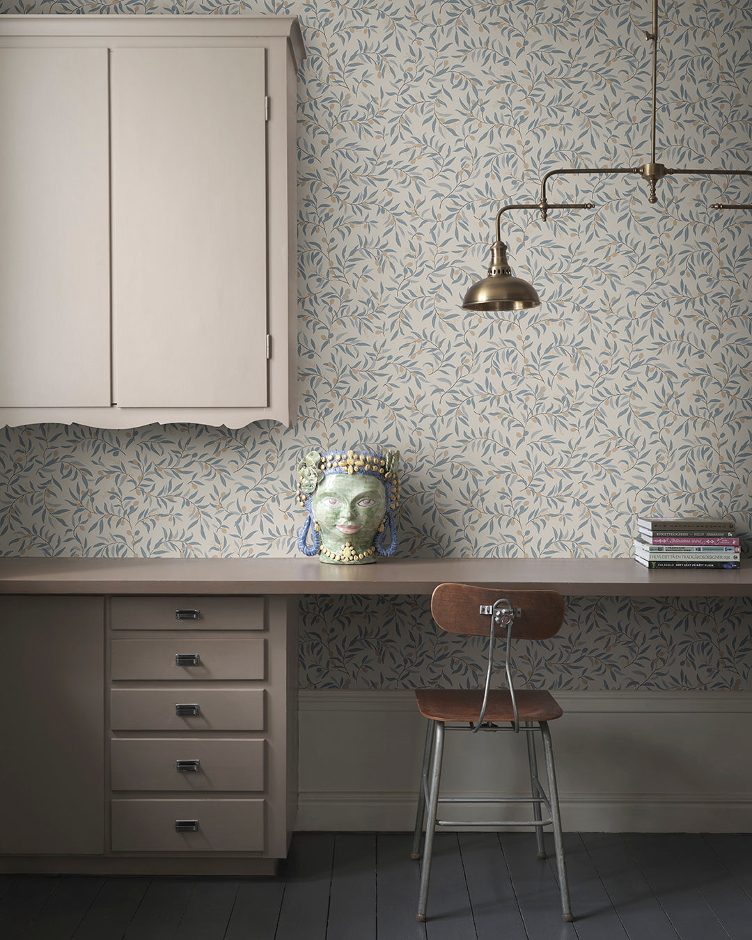  Immerse your space in serenity with Olivia's delicate olive branches in soft light blue hues. This pattern brings a Mediterranean feel, offering a breezy, elegant touch to any room. 