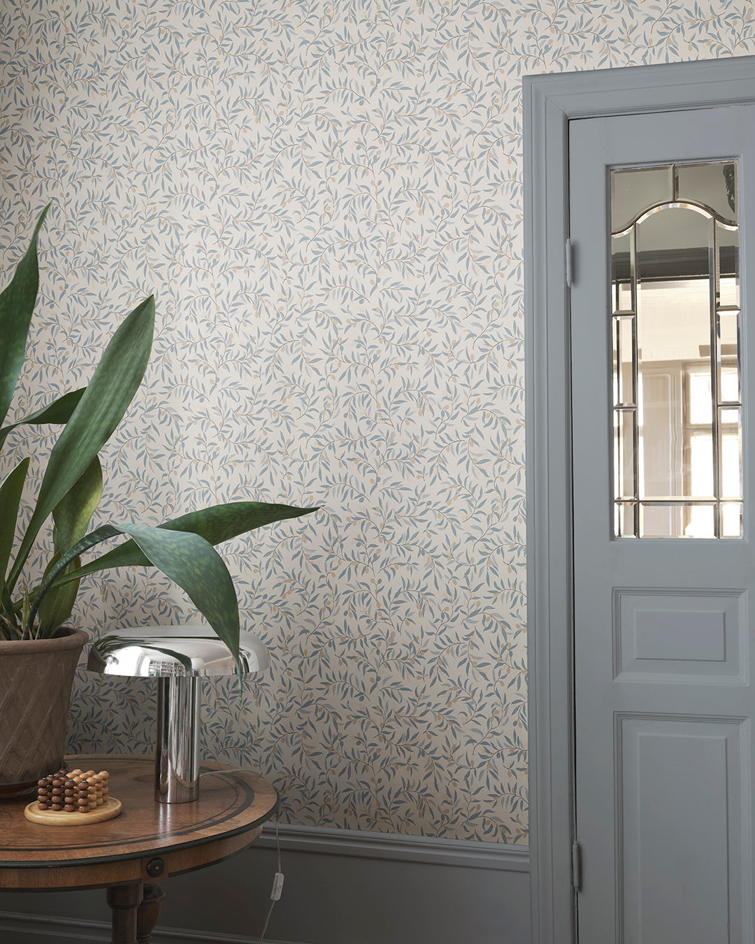  Immerse your space in serenity with Olivia's delicate olive branches in soft light blue hues. This pattern brings a Mediterranean feel, offering a breezy, elegant touch to any room. 