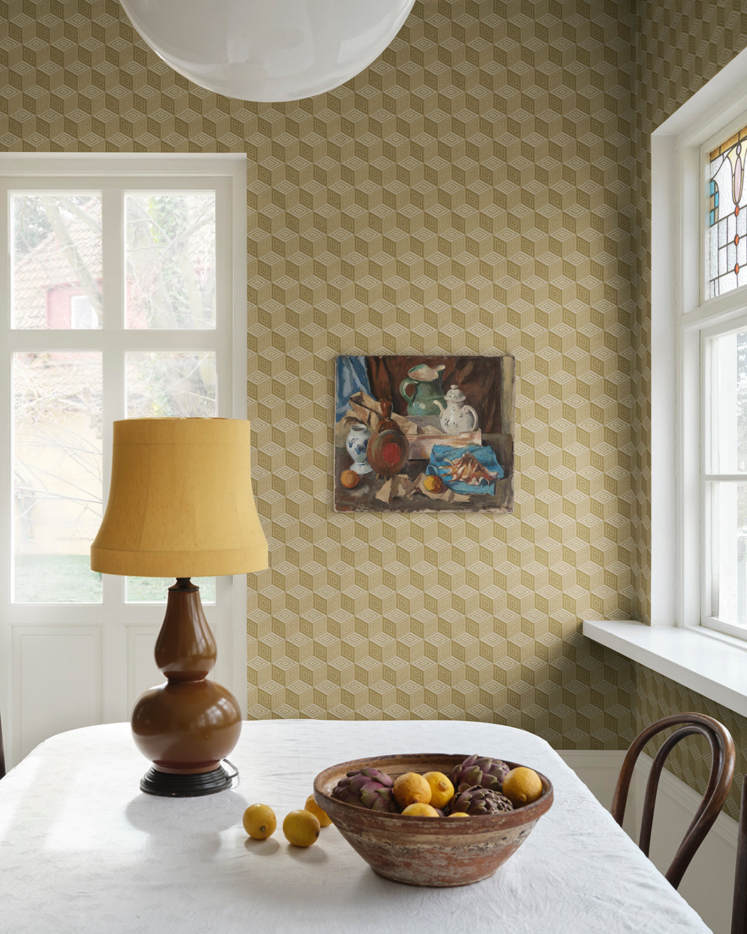 Chiara Honey offers a mesmerizing geometric pattern reminiscent of elegant silk with its honeyed hues. This luxurious wallpaper transforms any space into a sophisticated retreat, evoking the charm of Como's rich silk heritage and bringing a touch of timeless elegance to your walls.