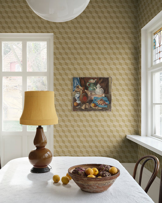 Chiara Honey offers a mesmerizing geometric pattern reminiscent of elegant silk with its honeyed hues. This luxurious wallpaper transforms any space into a sophisticated retreat, evoking the charm of Como's rich silk heritage and bringing a touch of timeless elegance to your walls.