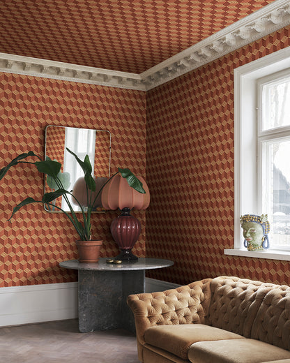 Chiara in terracotta captures the elegance of Como's renowned silk heritage with a striking geometric pattern. This design mimics an elegant scarf, infusing a touch of modern international flair and decorative warmth into any space. The vivid palette of rich terracotta hues brings an inviting vibrancy to your walls.