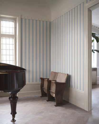 The Sam Light Blue Wallpaper introduces a refined elegance with its classic stripe pattern in calming blue tones. Perfect alone or paired with complementary designs, this wallpaper brings a hint of Southern European charm and sophistication to any space.