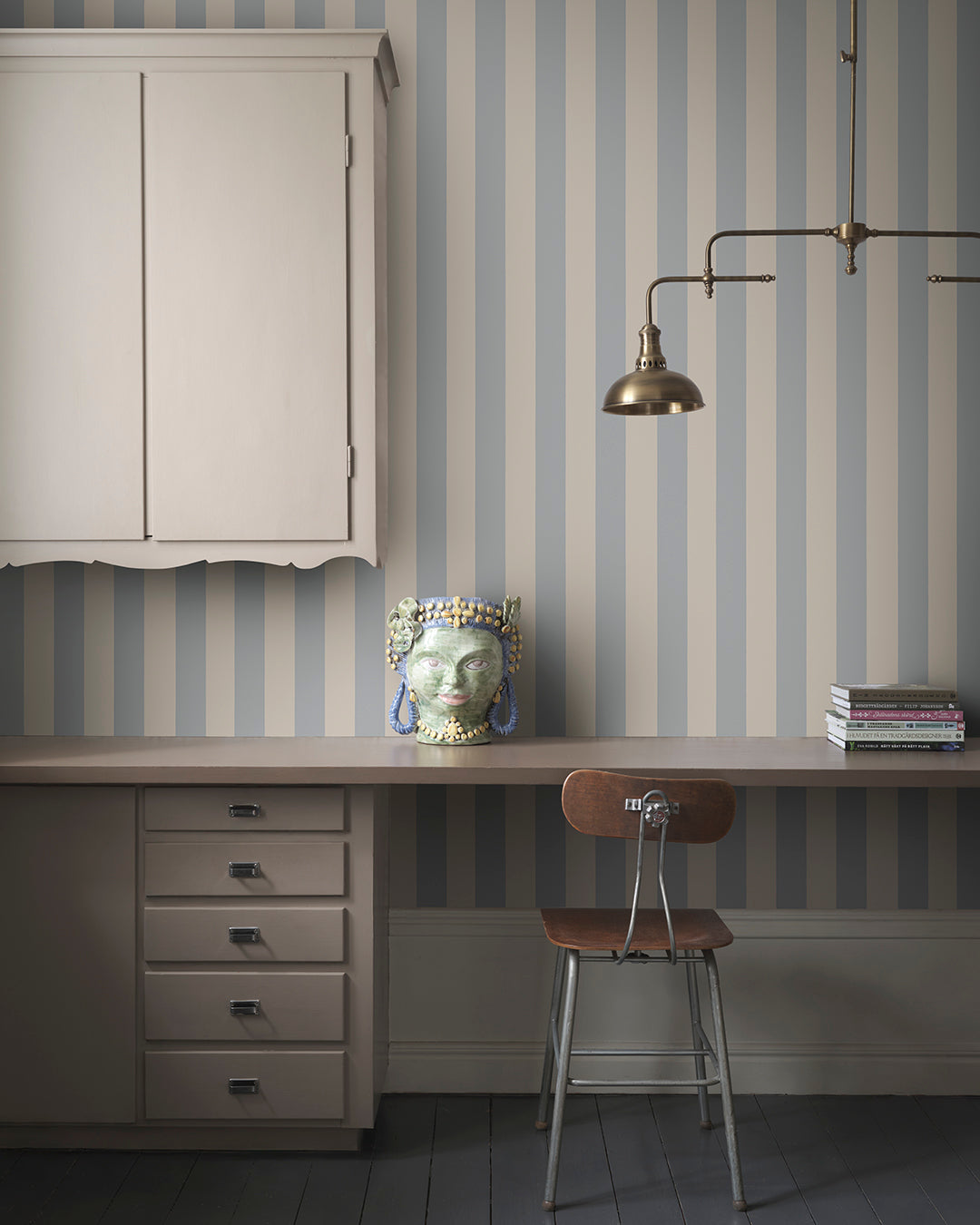 The Sam Light Blue Wallpaper introduces a refined elegance with its classic stripe pattern in calming blue tones. Perfect alone or paired with complementary designs, this wallpaper brings a hint of Southern European charm and sophistication to any space.