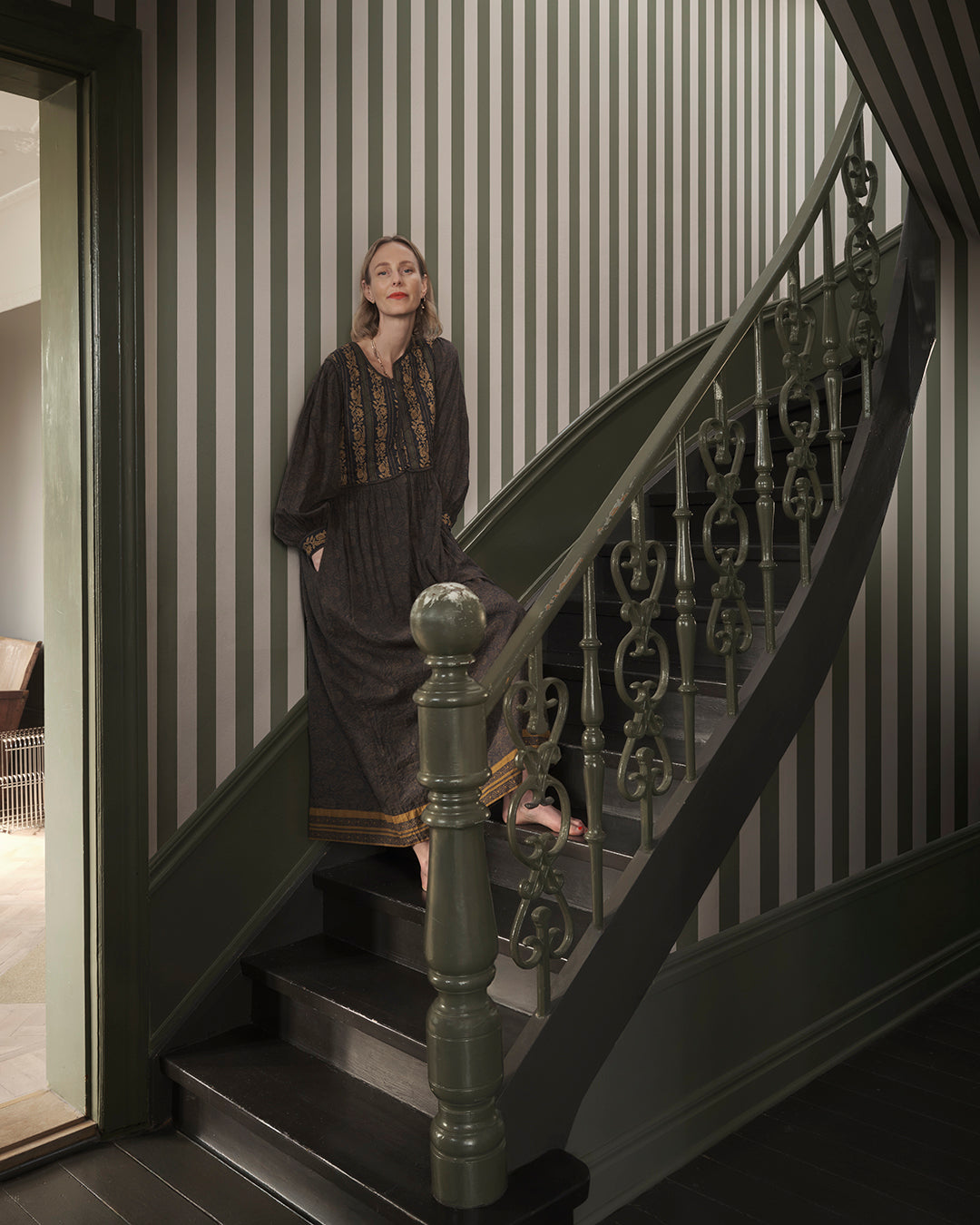Elevate your space with the timeless elegance of the Sam wallpaper in forest green. Its rich, bold stripes bring a touch of Southern European charm and sophistication, effortlessly blending into any interior style with a striking yet harmonious design.
