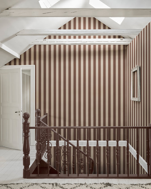 Sam in Burgundy is a sophisticated stripe pattern, blending Southern European elegance with rich, warm colors. Ideal for creating visual height and adding a touch of timeless charm to any space. This wallpaper can be used alone or paired with other designs for a coordinated look.