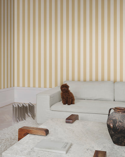 The Sam, Honey wallpaper features timeless stripes in warm hues, adding a touch of Southern European elegance to any room. Ideal for those seeking a blend of classic and contemporary style in their space.