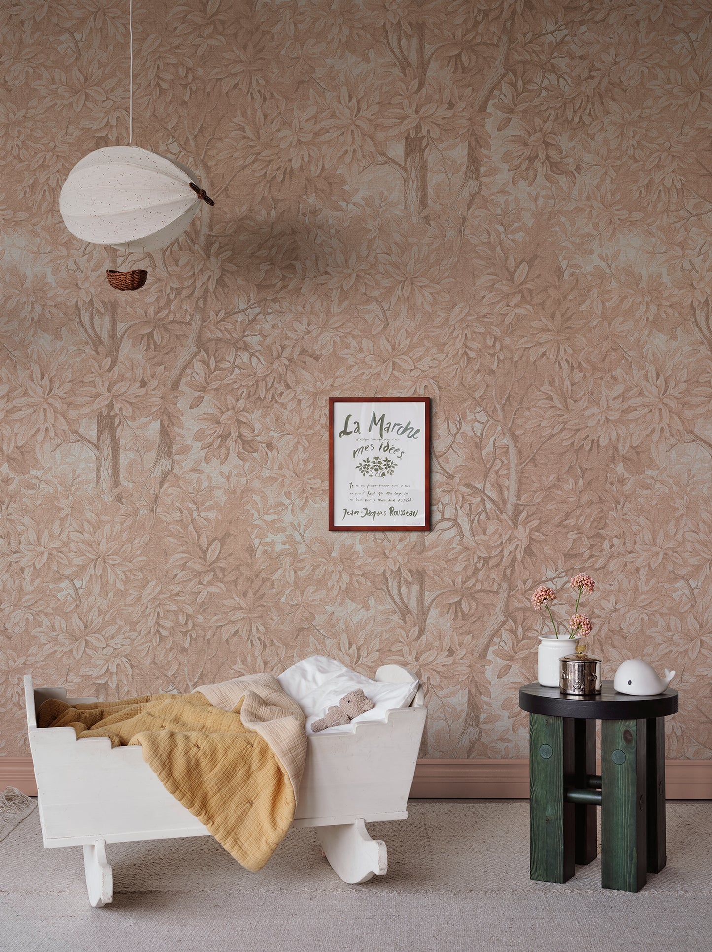  Immerse yourself in a blush-hued forest landscape with the Charles wall mural. 
