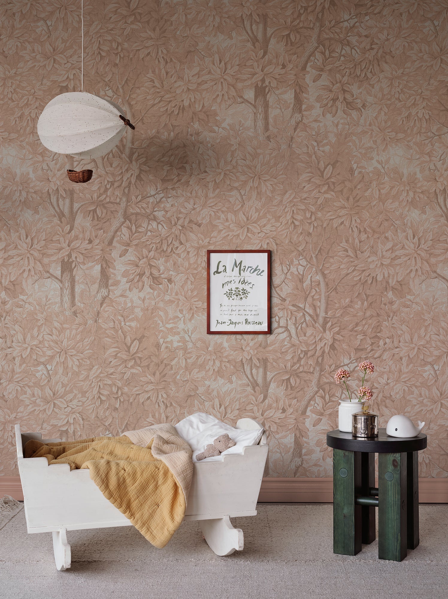  Immerse yourself in a blush-hued forest landscape with the Charles wall mural. 