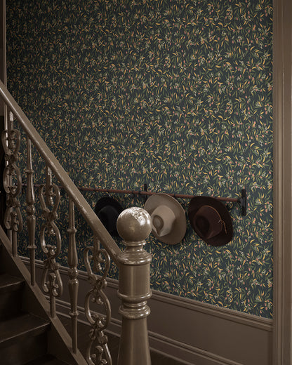  Olivia in Charcoal brings a Mediterranean flair to your walls with its winding olive branches and lively leaves. 