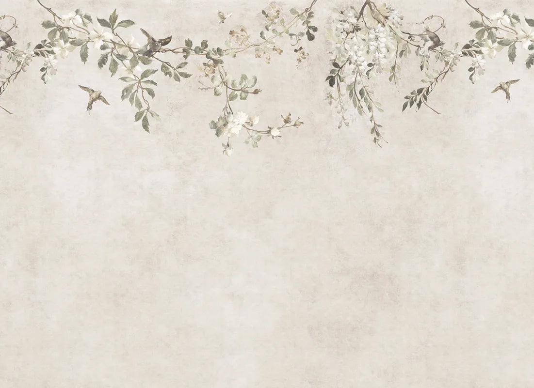 Transform your space with the Nico mural. This design evokes a serene Mediterranean pergola, featuring delicate blooming vines and small birds against a soft, lime-washed backdrop. 