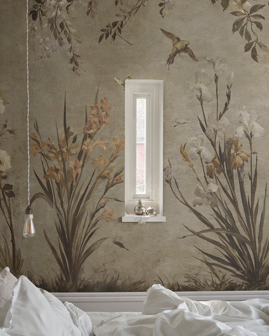 Nicola Beige mural blends antique romance with a painterly touch. Birds, flowers, and a soft patina enrich your space with historical elegance, making it an alluring centerpiece.