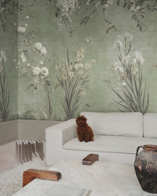Adorn your walls with the Nicola mural, where antique charm meets nature's embrace. Graceful flowers and whimsical birds gently unfurl against a serene sage green backdrop, creating a romantic, hand-painted elegance.