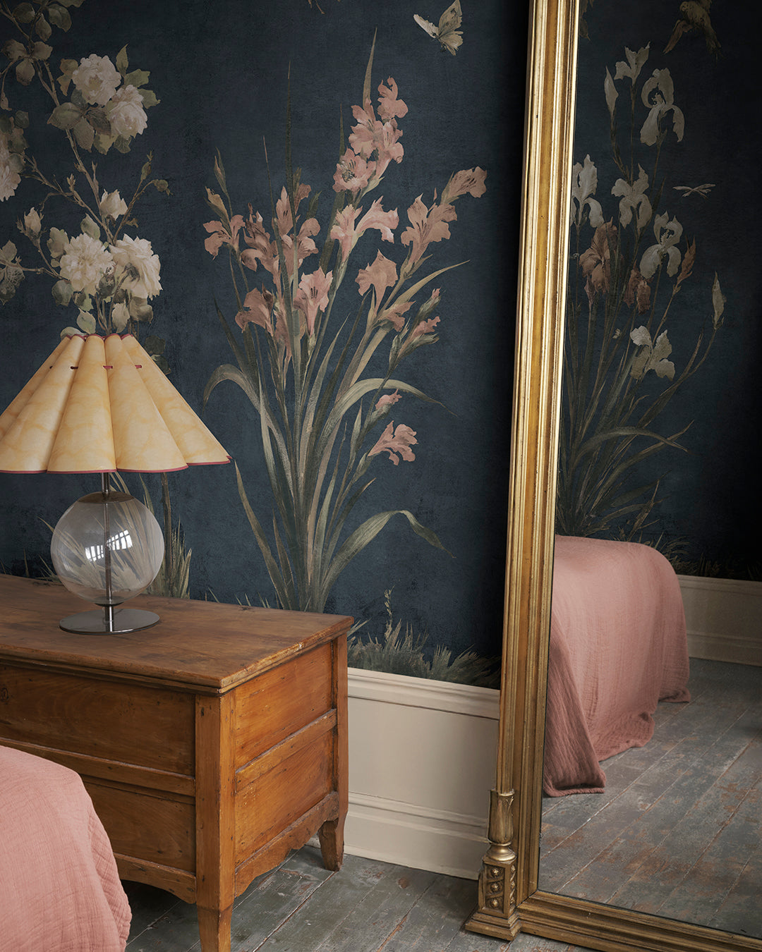 Immerse your space in the romantic elegance of Nicola's classic blue wallpaper. This mural, inspired by antique Southern European textiles, features birds and flowers that artistically flourish against a deep blue backdrop