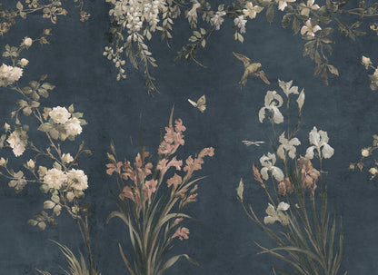 Immerse your space in the romantic elegance of Nicola's classic blue wallpaper. This mural, inspired by antique Southern European textiles, features birds and flowers that artistically flourish against a deep blue backdrop