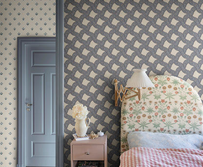  Annie Blue is a delightful medallion wallpaper inspired by 18th-century French design. 