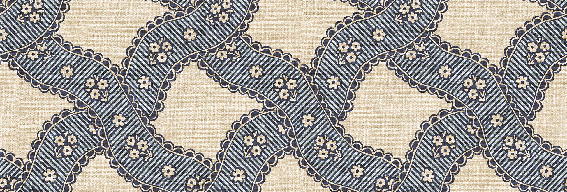  Annie Blue is a delightful medallion wallpaper inspired by 18th-century French design. 