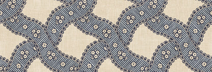  Annie Blue is a delightful medallion wallpaper inspired by 18th-century French design. 