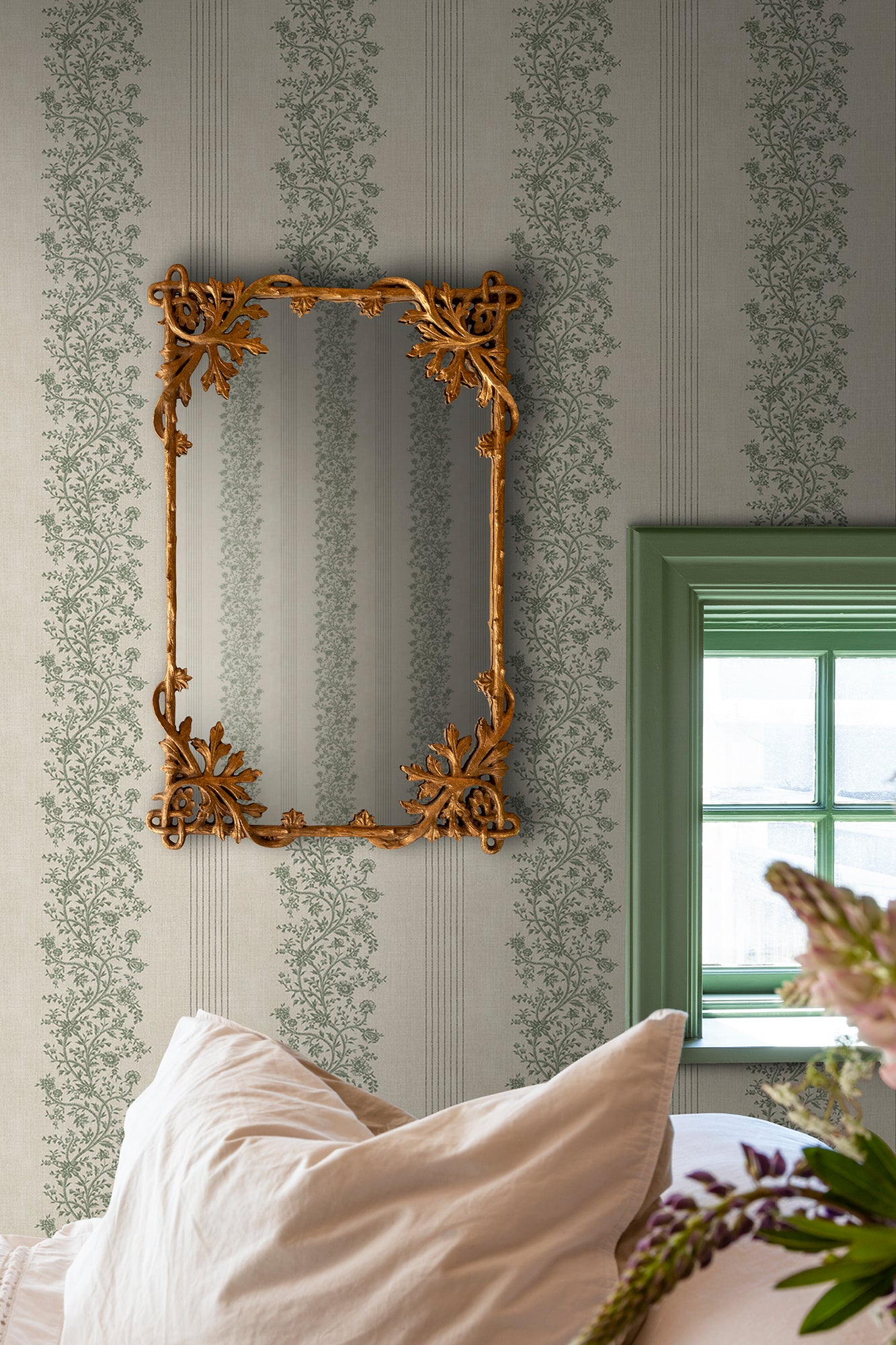  Embrace timeless elegance with the Natalie wallpaper, flaunting graceful floral garlands intertwined with classic stripes. 