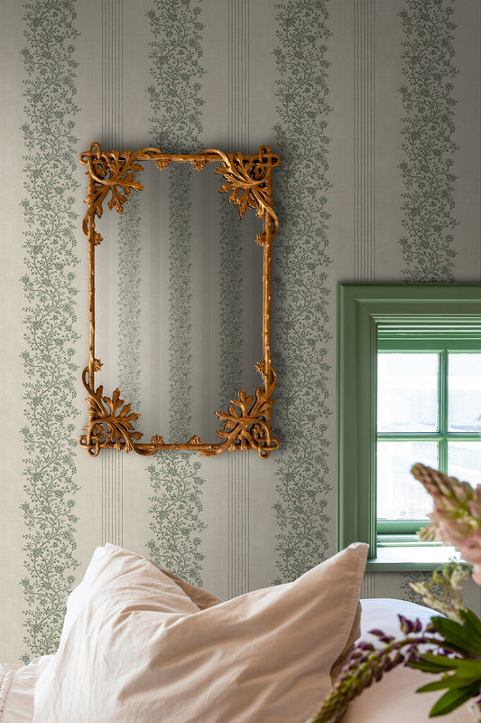  Embrace timeless elegance with the Natalie wallpaper, flaunting graceful floral garlands intertwined with classic stripes. 