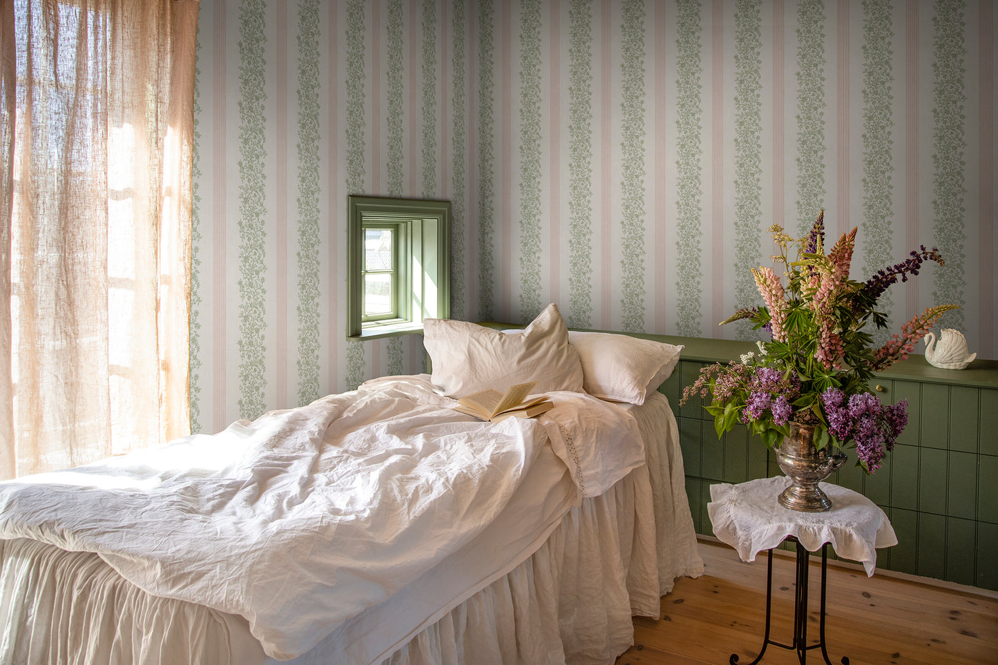 Embrace the romance of a classic stripe with Natalie Pink. This pattern intertwines delicate floral garlands with elegant woven stripes, revitalizing 19th-century French elegance in a modern palette