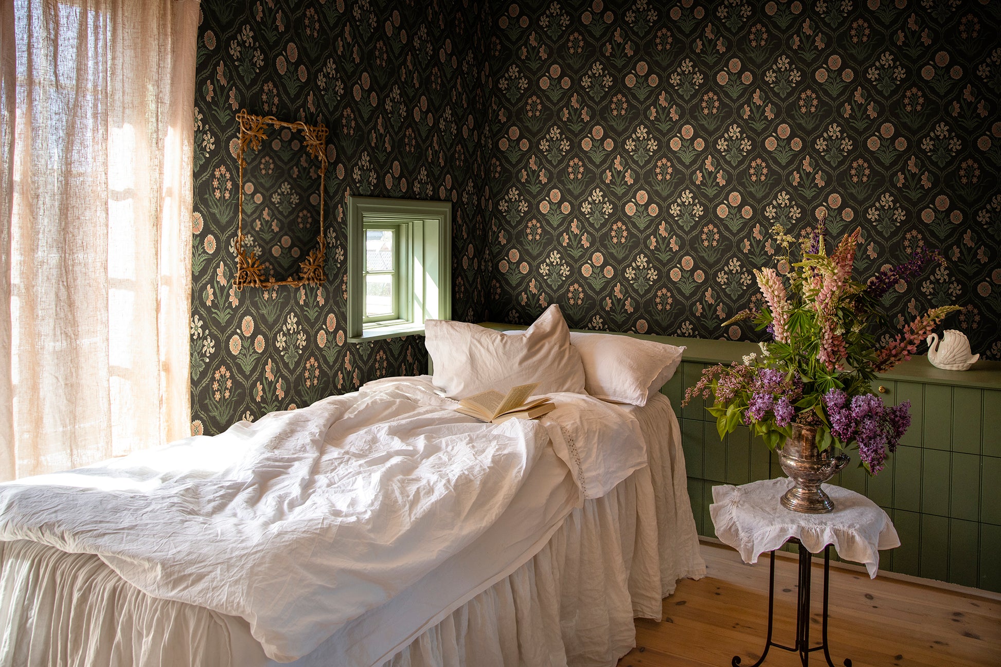 Rosa Charcoal wallpaper brings a touch of French elegance with its 19th-century inspired floral medallions.