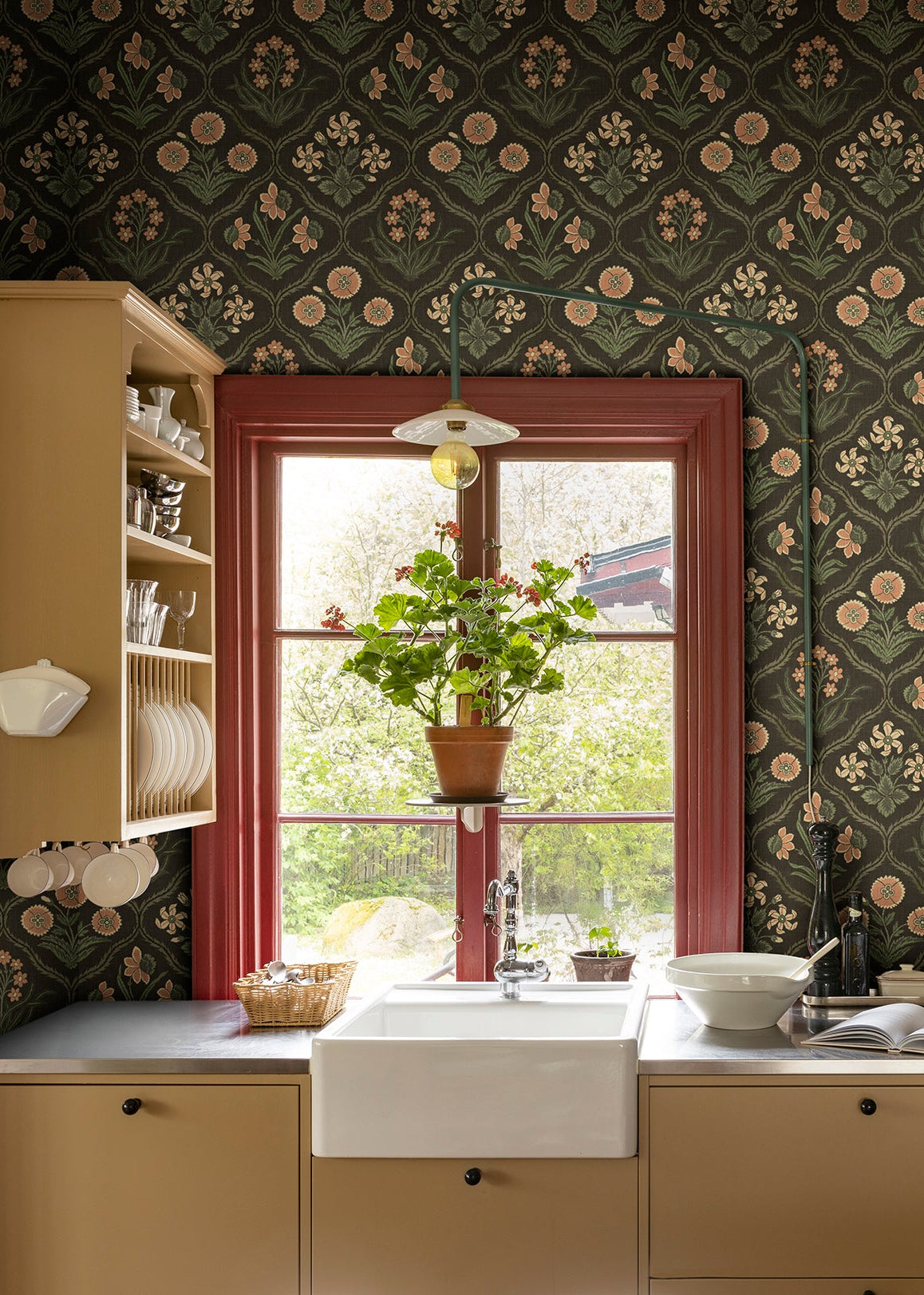 Rosa Charcoal wallpaper brings a touch of French elegance with its 19th-century inspired floral medallions.