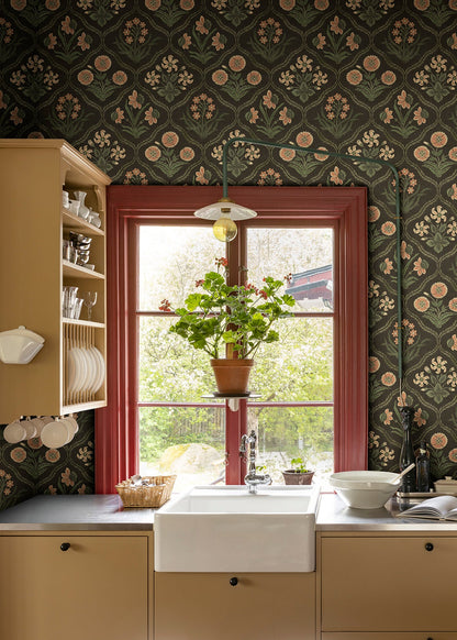 Rosa Charcoal wallpaper brings a touch of French elegance with its 19th-century inspired floral medallions.