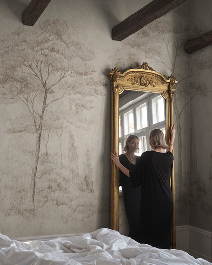 Andrea brings the serene beauty of Italian gardens indoors with its detailed pencil work depicting conifers and cypresses. This mural offers a refined, historical style that adds height and sophistication to any space, making it perfect for those who appreciate classic artistry.

