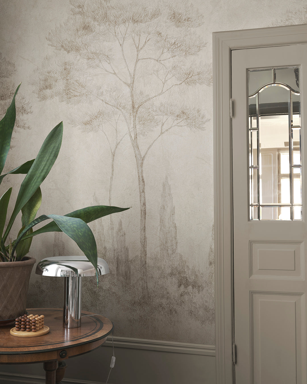 Andrea brings the serene beauty of Italian gardens indoors with its detailed pencil work depicting conifers and cypresses. This mural offers a refined, historical style that adds height and sophistication to any space, making it perfect for those who appreciate classic artistry.
