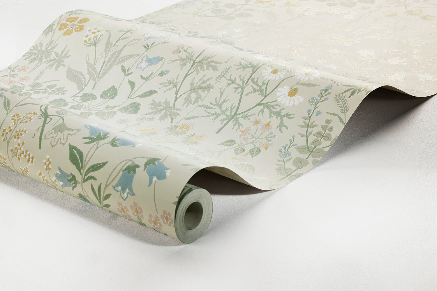 Colored in a pretty pastel palette of green, pink, yellow, white and blue, our Flora wallpaper celebrates the sublime sights and scents of a Swedish spring meadow.