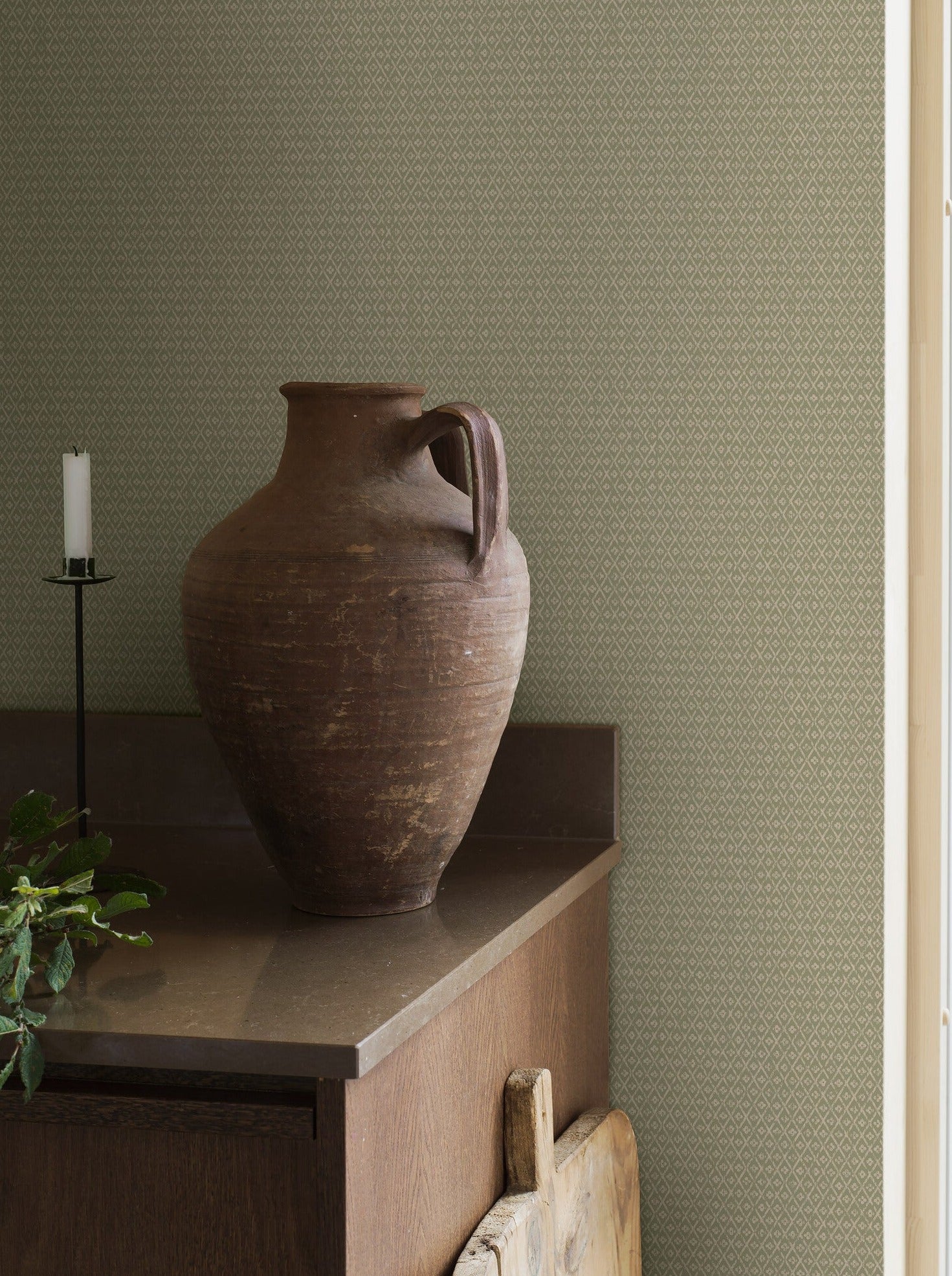 Willowherb wallpaper is simple and rustic. Having the appearance of a single-color surface from a distance, its pretty petite design features a stylized four-petal flower within a diamond trellis pattern.