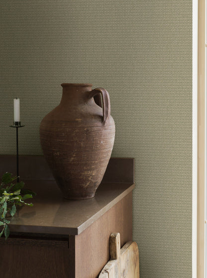 Willowherb wallpaper is simple and rustic. Having the appearance of a single-color surface from a distance, its pretty petite design features a stylized four-petal flower within a diamond trellis pattern.
