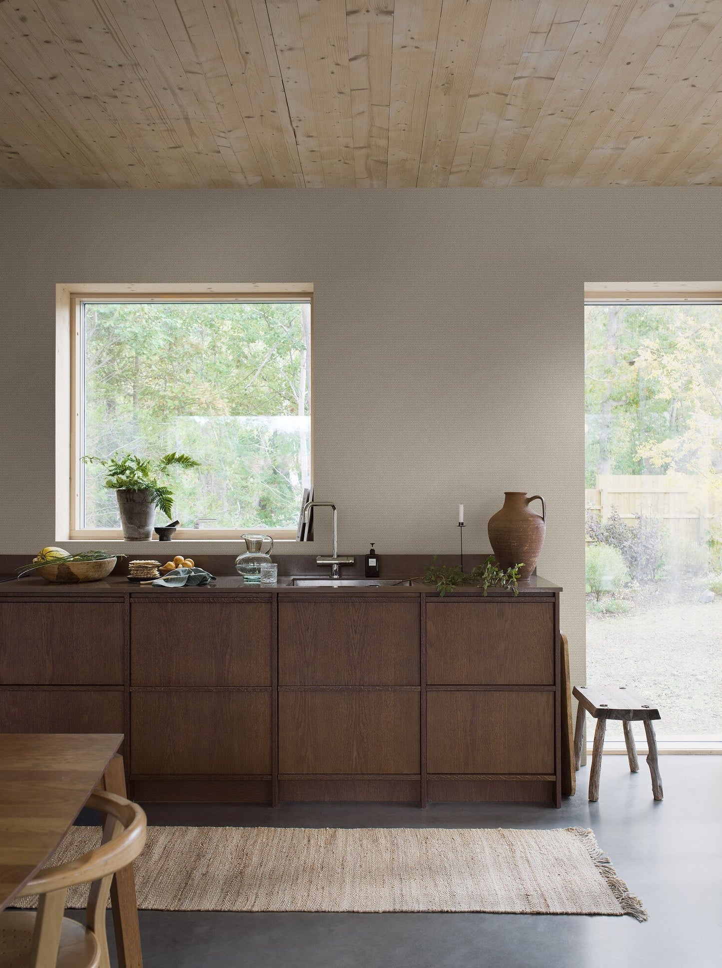 Willowherb wallpaper is simple and rustic. Having the appearance of a single-color surface from a distance, its pretty petite design features a stylized four-petal flower within a diamond trellis pattern.