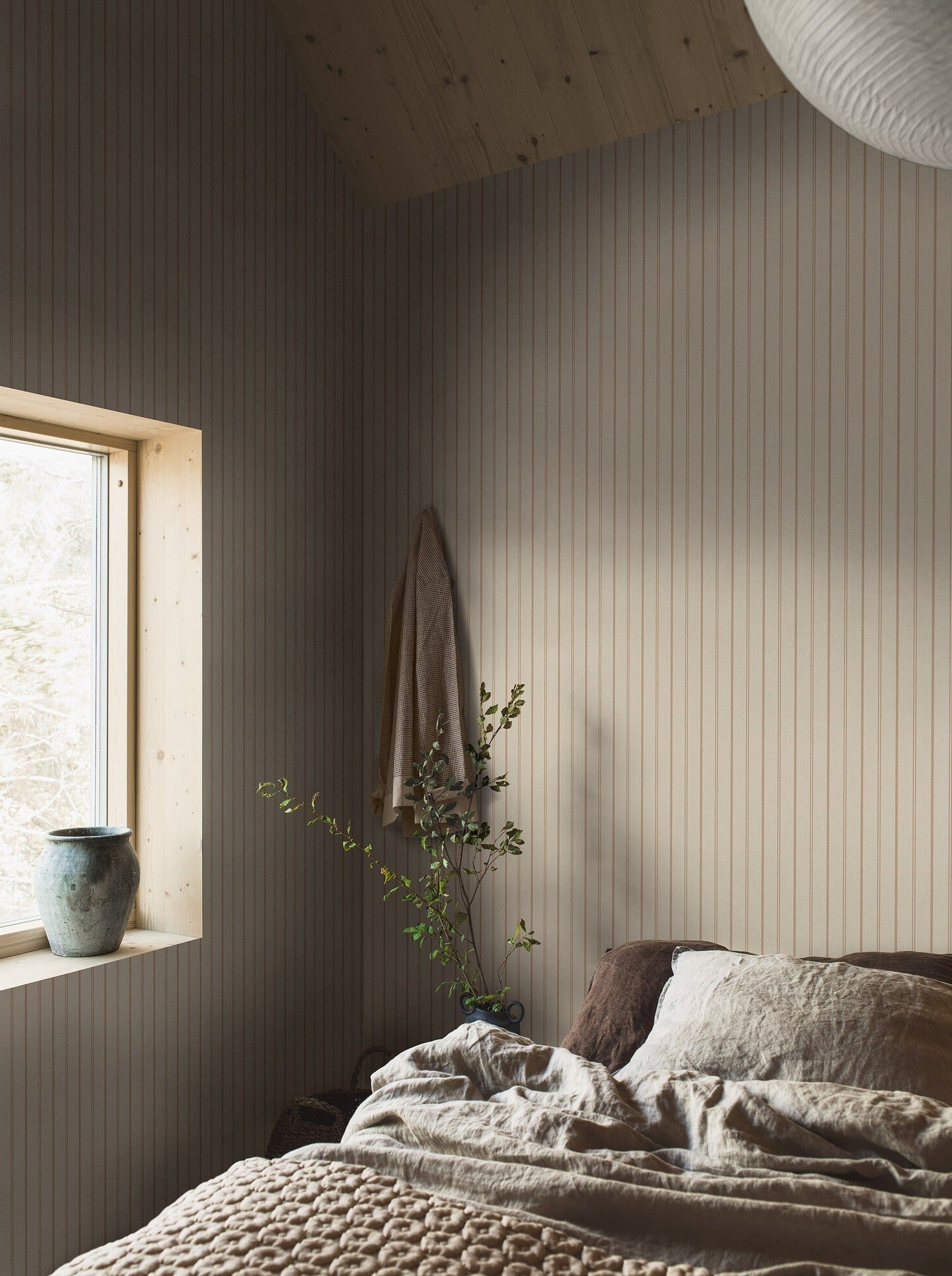 Woodland Stripe wallpaper is printed on our popular linen surface to create a tactile and cosy expression. 