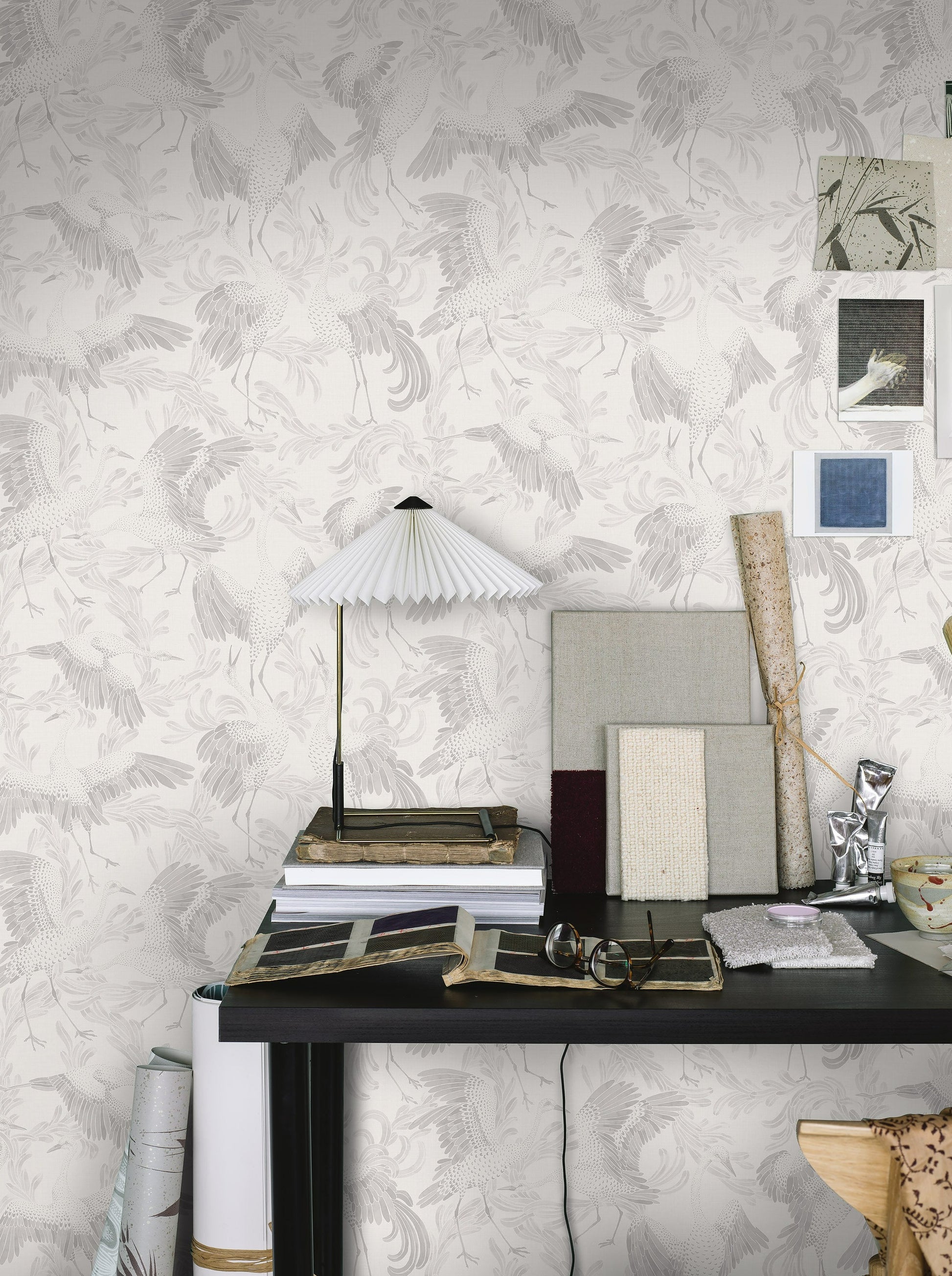 Coloured in authentically age-faded shades of white, sepia and beige, our Dancing Crane wallpaper adds a touch of vintage elegance to the interiors it adorns. 