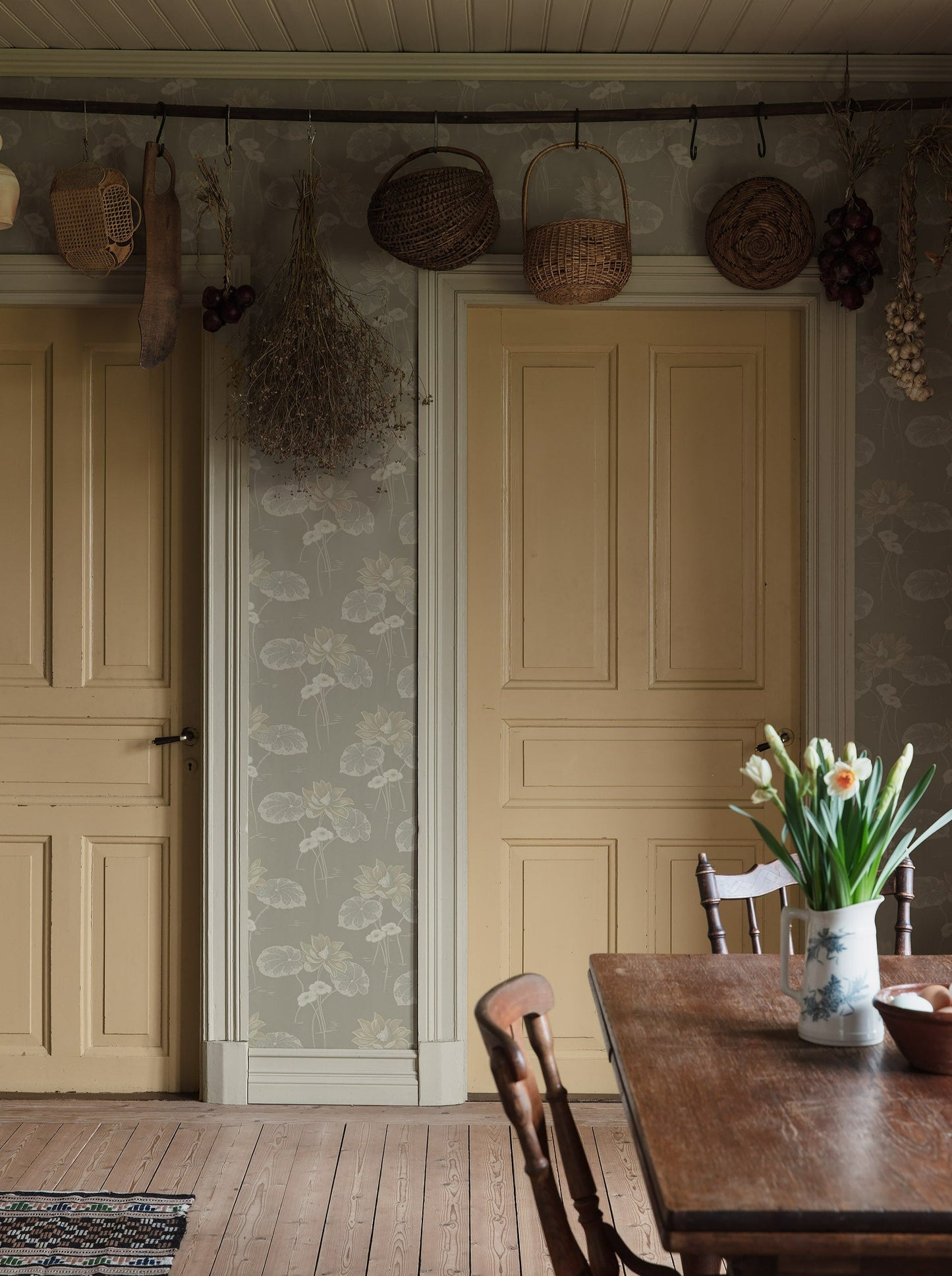  Colored in soft neutral palette of grey, white and gently shimmering silver tones, our Haga wallpaper is inspired by the beauty of Swedish nature. 